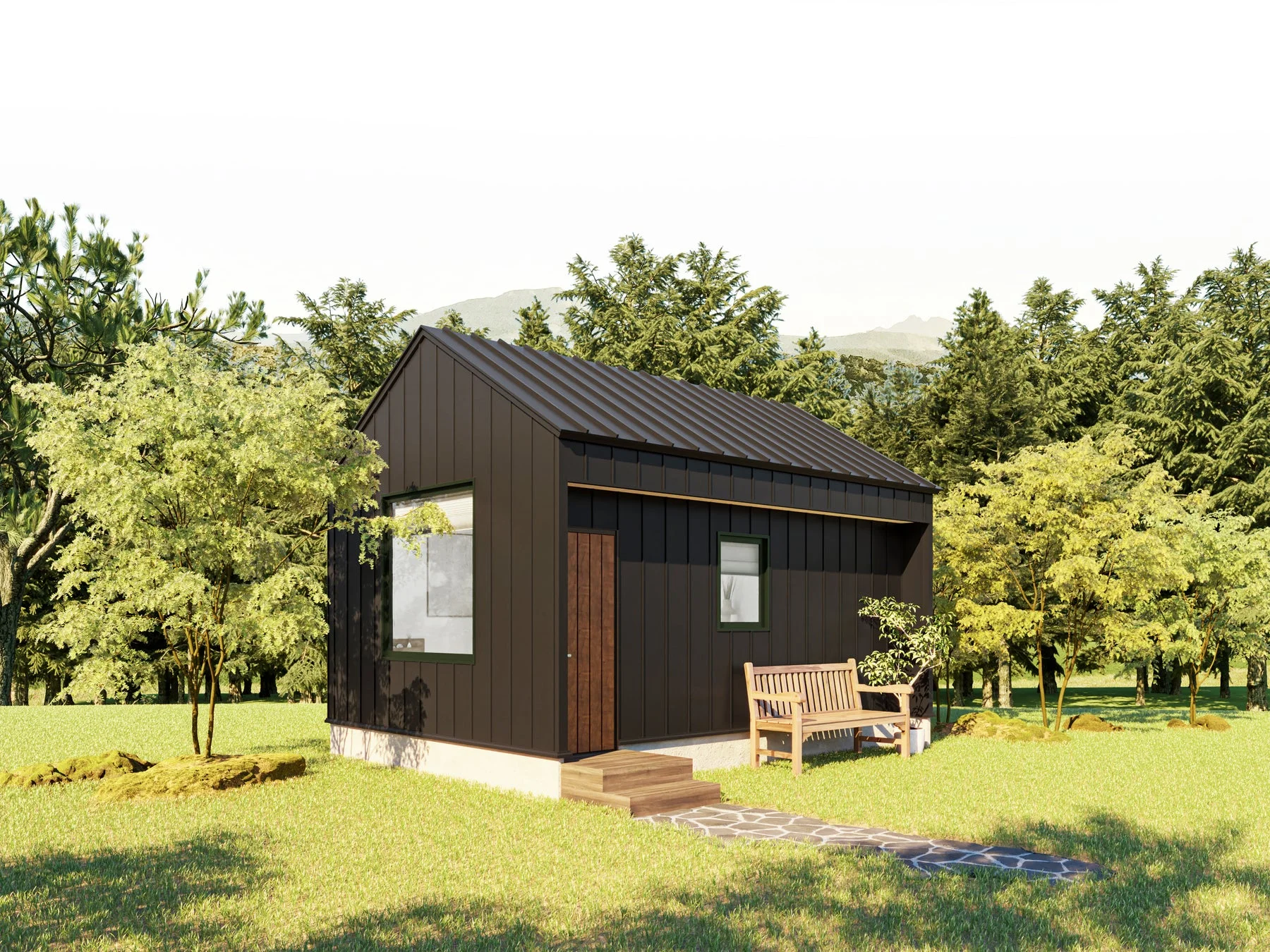 緑豊かな自然の中に建つ、黒い外壁と屋根が特徴のモダンな小さな家