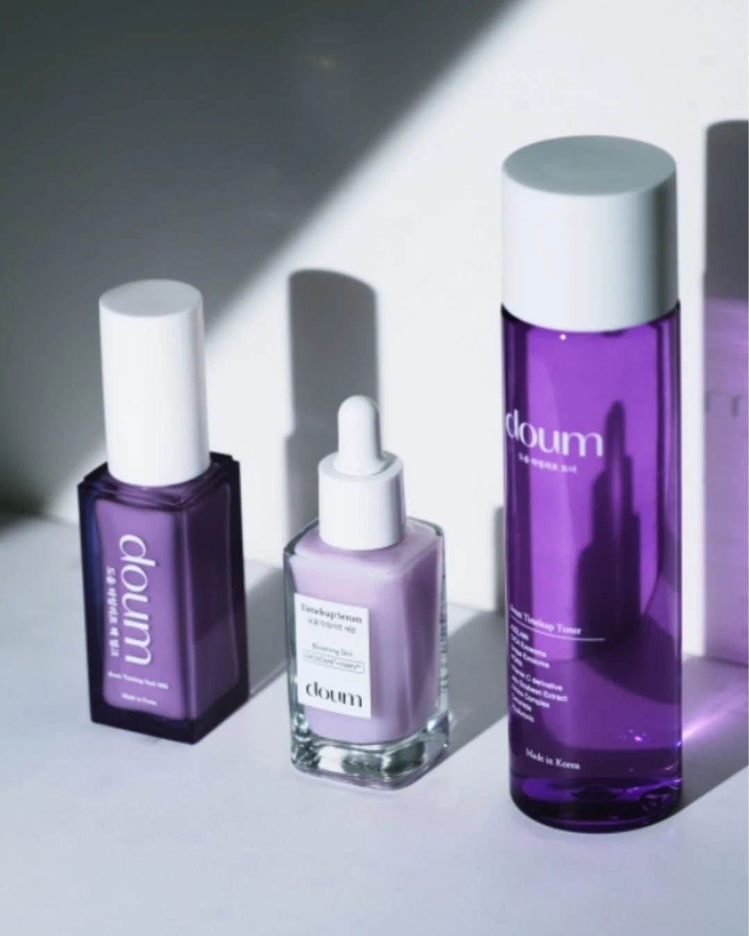 紫色のボトルに入ったdoum製品