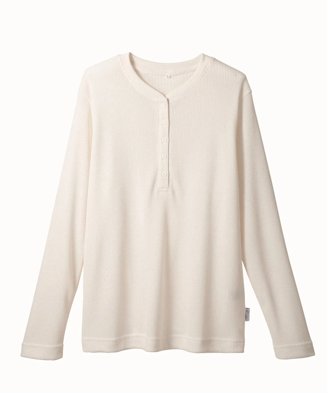 オフホワイトのワッフルヘンリートップス