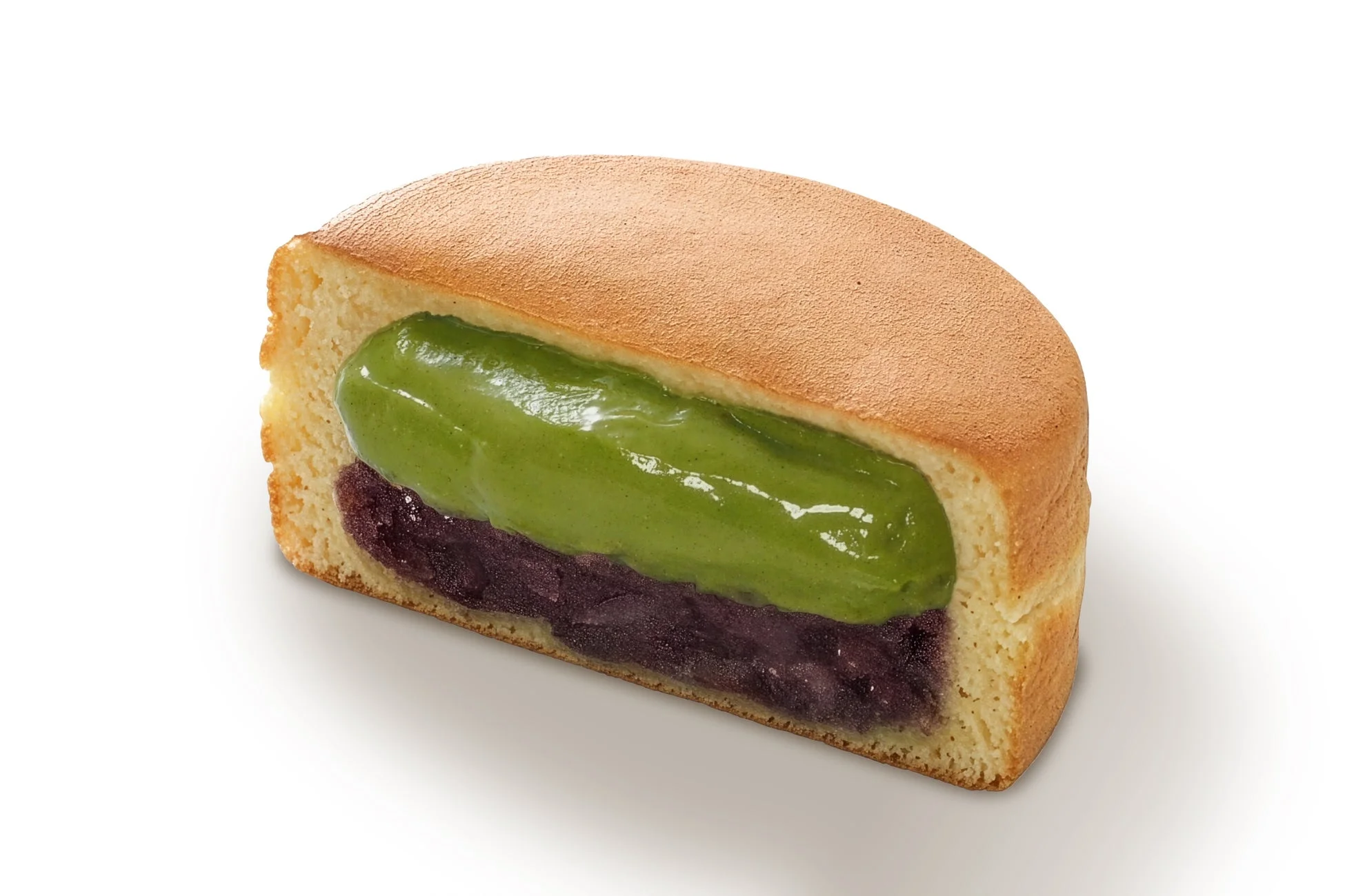 抹茶クリームとつぶあんが詰まった大判焼の断面
