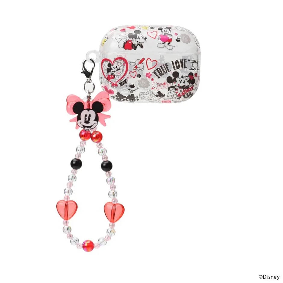 ミッキーとミニーのイラストが散りばめられたクリアなAirPodsケースに、ミニーマウスのチャームとピンクのハートビーズがあしらわれたストラップ