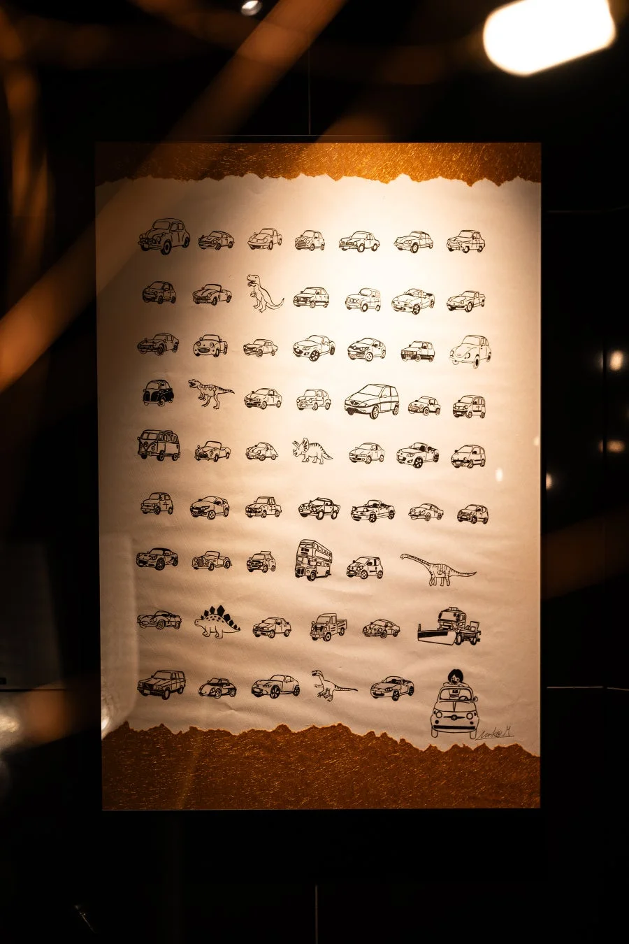 車と恐竜が描かれた松山倫子さんの作品